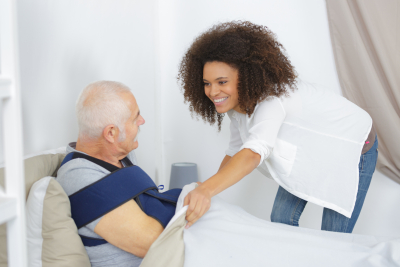 caregiver taking care of the senior man